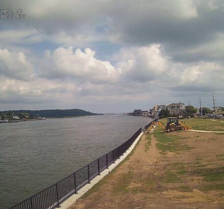 Looking downstream along a riverbank and along the river