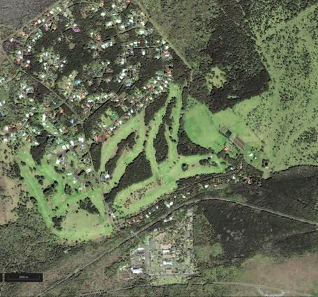 Color satellite image of developed area near summit of volcano