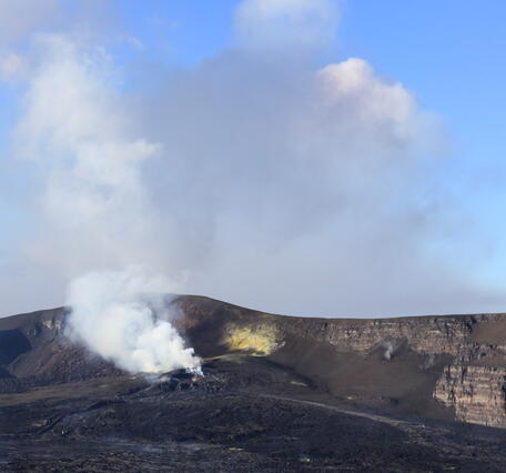 Color photograph of volcanic vents degassing