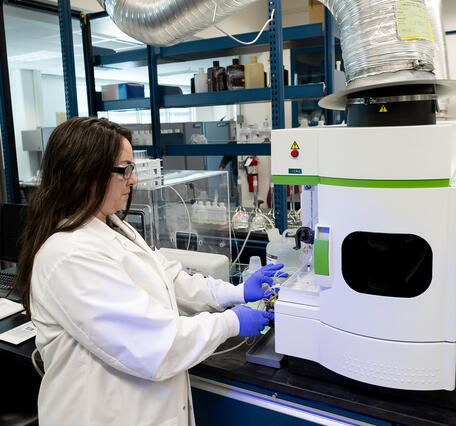 scientist using a water chemistry analyzer