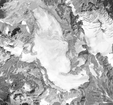 Black and white aerial view of a glacier.