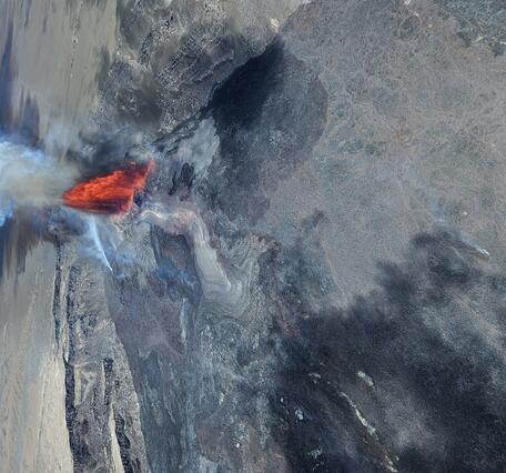 Color photograph of lava fountain in crater