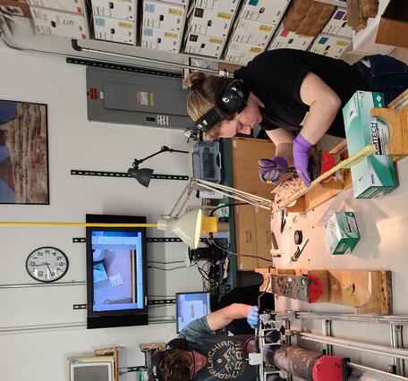 Interns working with sediment cores in a laboratory