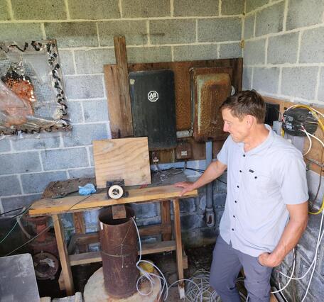 Scientist standing next to a state observation well
