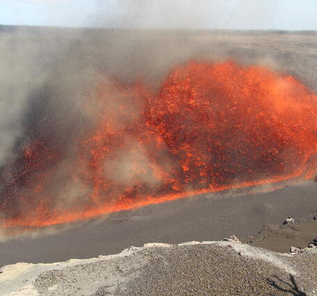 Colro photograph of lava erupting at an angle