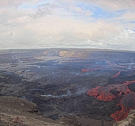 Color webcam image showing lava fountaining and lava flows within a volcanic crater