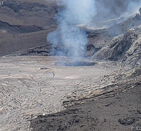 Color photograph showing a volcanic vent degassing