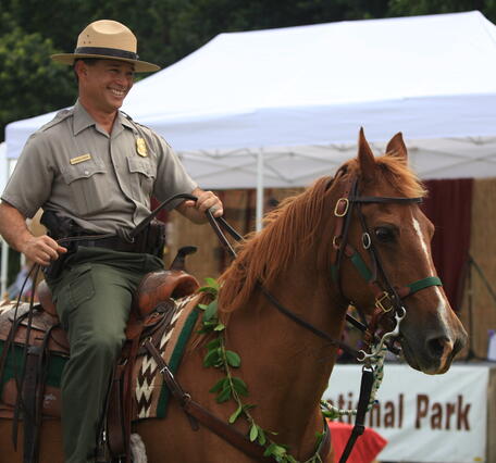 Color photograph of National Park Ranger on a horse