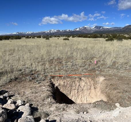 Photograph showing pit excavated on the Puya Fault in northern New Mexico to determine ages of faulted surfaces