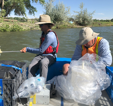 Researchers collecting surface-water samples on the Animas River, New Mexico, June 2022