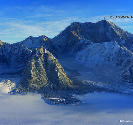 Snowy mountain with a label showing the size of a debris lobe at the base of the mountain