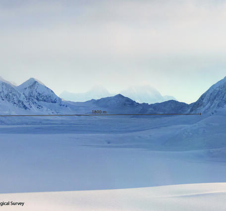 Snowy mountain and valley with label showing the size of the debris lobe as 1800m long