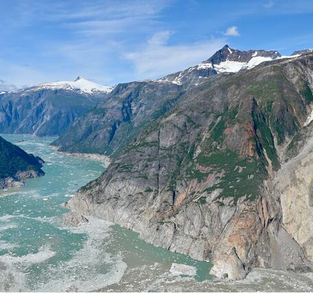 Aerial photo of mountainous landscape with landslide on the right hand side 