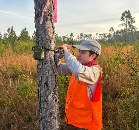 A researcher setting up an Autonomous Recording Unit