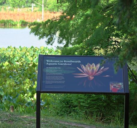 A welcome sign stands near the entrance to Kenilworth Aquatic Gardens.