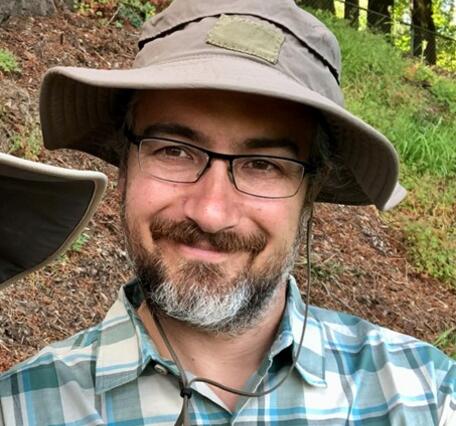 Headshot picture of Adam Mumford.