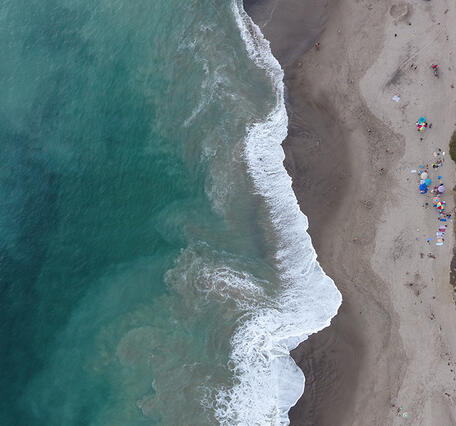 Photo showing aerial nadir view of a sandy shoreline in southern California