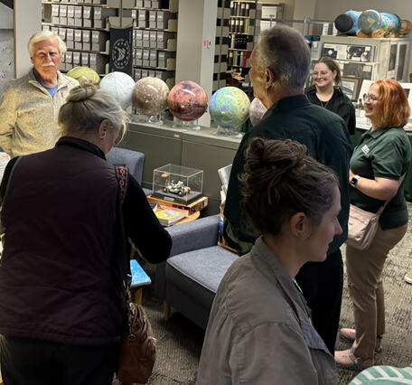 Shown are speakers and presenters mingling in the USGS Astrogeology Area