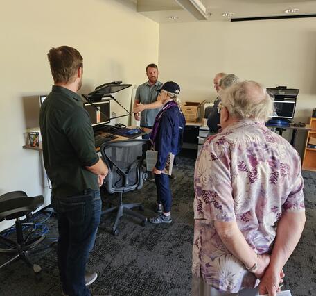 A USGS cartographer speaks to the public in the Photogrammetry Lab at the Flagstaff USGS Open House