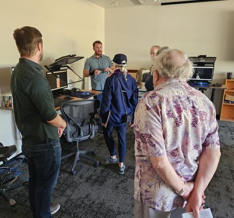 A USGS cartographer engages with the public in the Photogrammetry Lab at the USGS Flagstaff Open House