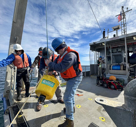 Researchers from the Woods Hole Coastal and Marine Science Center recover oceanographic instruments off Cape Cod.