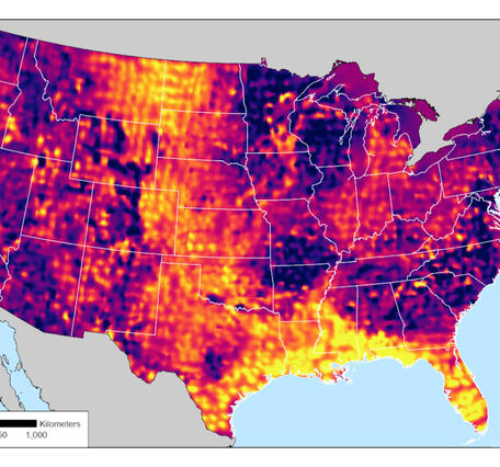 An elevation map of the contiguous United States with 'Electrical resistivity of the upper crust, here shown at 2 km depth, beneath the contiguous U.S. Warm colors reveal thick sedimentary basins beneath the Great Plains and along the Gulf coast. Cool colors show resistive mountain ranges and uplifts.