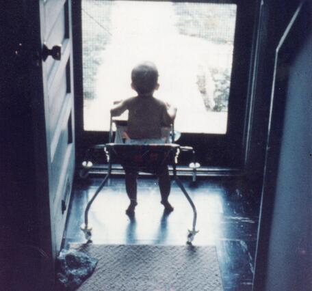 TNMCorps volunteer Spirit_of_Fundy as a baby staring out of a screen door. 