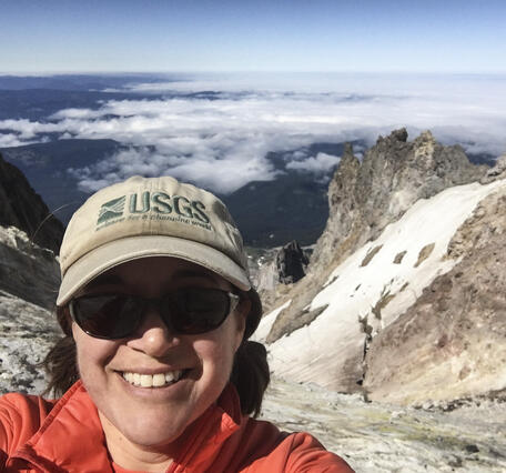 Laura Clor is a gas geochemist at the USGS, shown in this photo at Mount Hood, Oregon