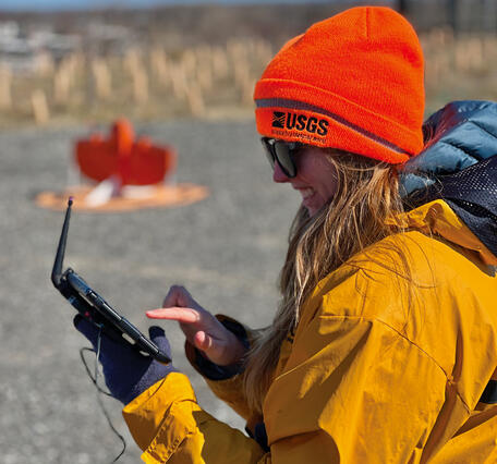 Researcher prepares a wingtra lidar flight at the Darby Creek landfill Superfund site 