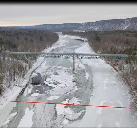 Aerial view of the Delaware River and the Bridge at Montague, New Jersey with a red line across the river