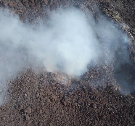 Color photograph of volcanic vent degassing