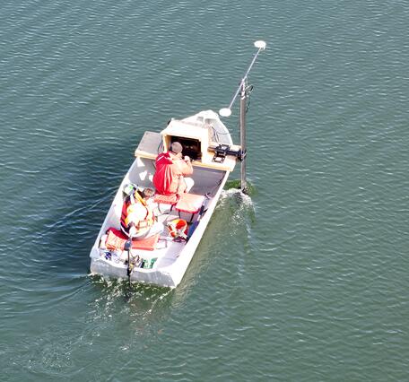 aerial view of small boat on pond