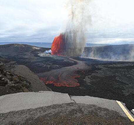Color photograph of lava fountain and lava flow