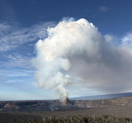 color photo looking towards the lava fountain producing a large stream cloud