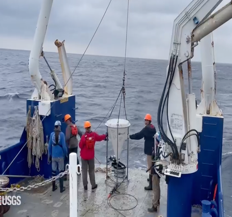 view looking towards back of ship as science crew prepare to deploy sediment trap