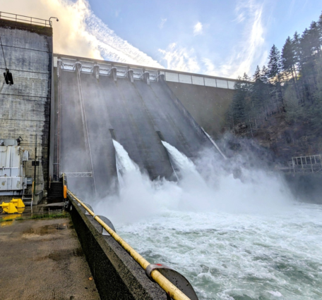 sloped concrete dam wall. 