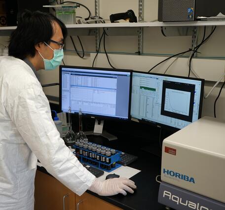 USGS scientist analyzing surface water samples for dissolved organic carbon concentration and characterization