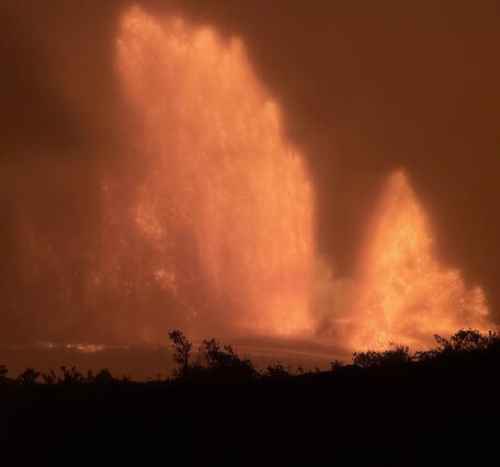 Color photograph of lava fountains at night