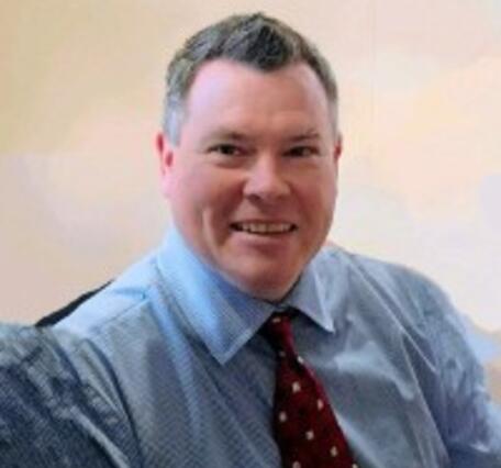 Headshot of Ethan Weikel.