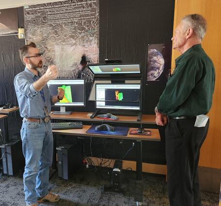 Visitors engaged with Astro’s photogrammetric workstations