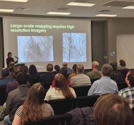 This is a photo of Rachel Fry giving a lecture at LPSC in 2025.