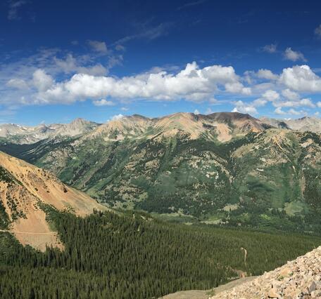 View of mountains from rocky slope