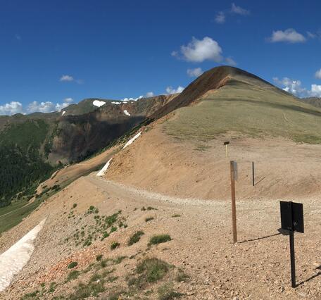 mountain with snow patch on ground