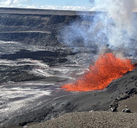 Lava fountaining from a vent in the crater wall