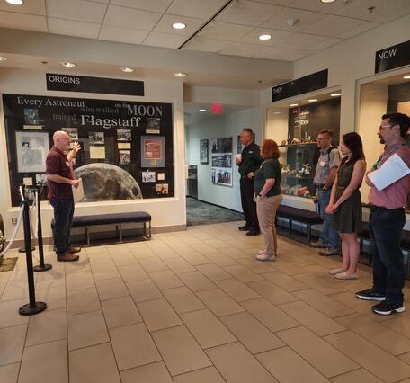 Tour Stop at Astrogeology Science Center: Discuss displays of historic artifacts on display in the lobby.
