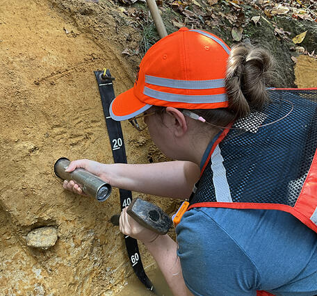 A USGS collects river samples for geologic analysis on Fountain Creek in Emporia, Virginia