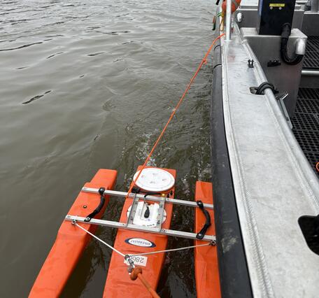 Acoustic Doppler current profiler measures flow off of the side of a boat