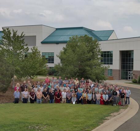 group of people standing in front of NWQL