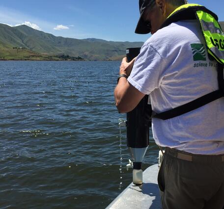 USGS scientists deploys sediment in a canyon reservoir