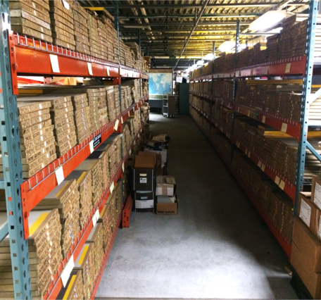 Color photograph of shelves with cardboard boxes on them
